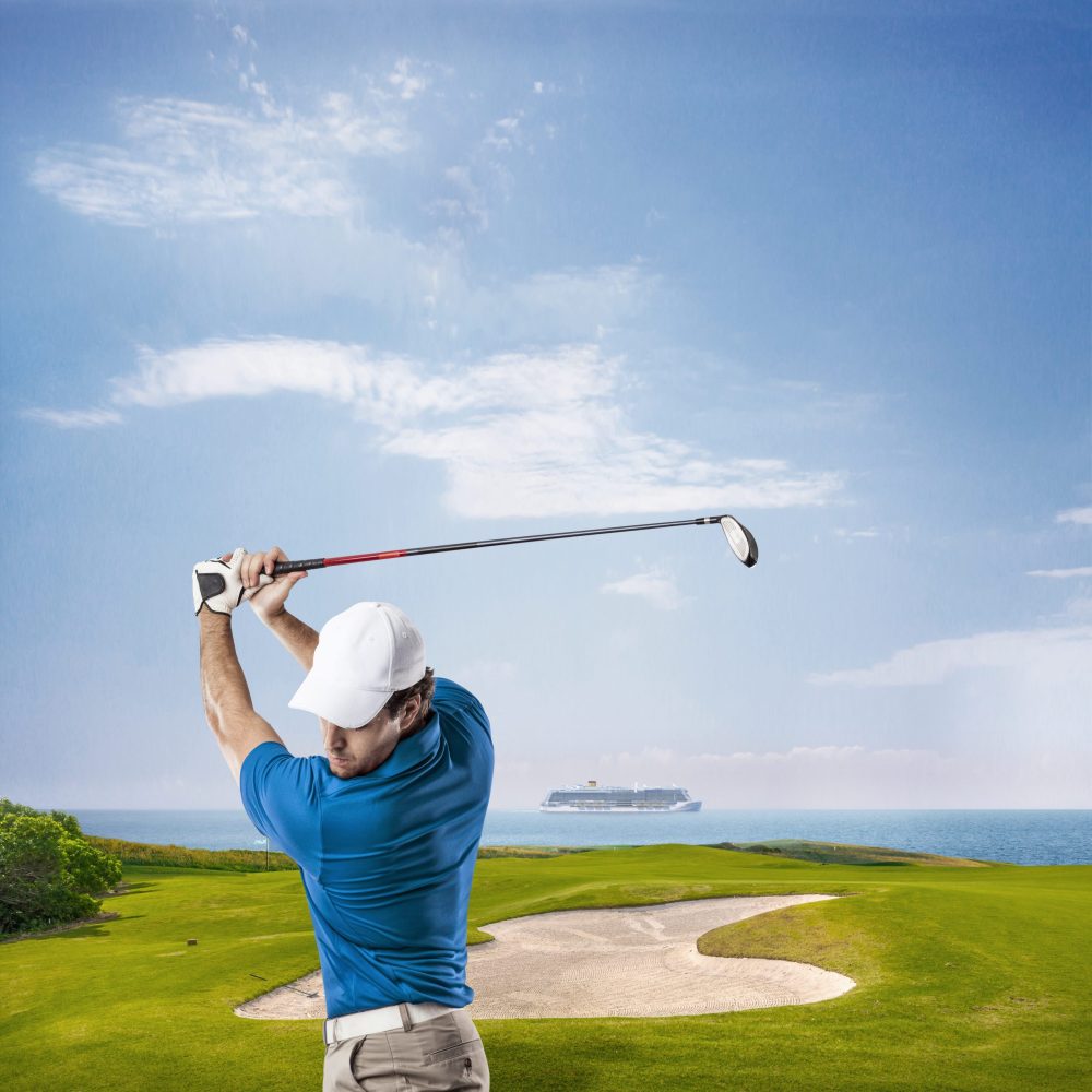 Golf Player in a red shirt taking a swing, on a white Background.